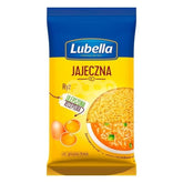 A package of Lubella - Jajeczna Pasta - 250g noodles, featuring images of eggs and a bowl of noodle soup, with Polish text.